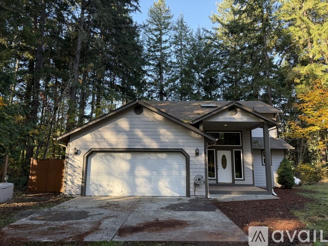 A house with a garage is available for sale.