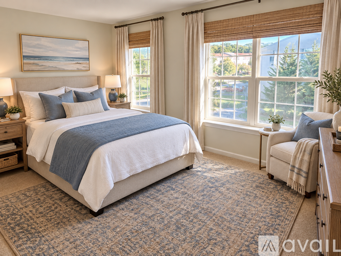 A bedroom with a large bed and a window with blinds.