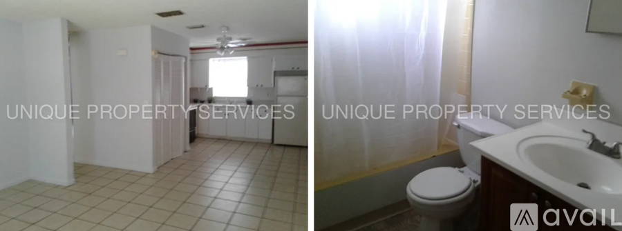 A bathroom with a toilet, sink, and shower.