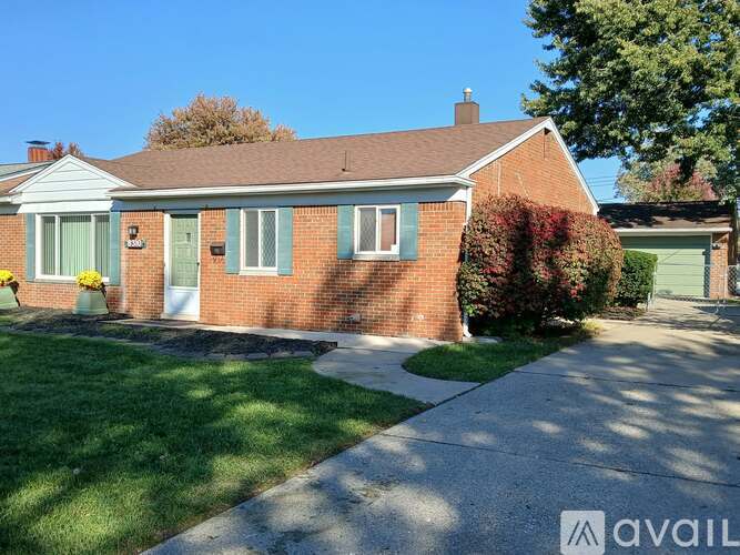 A house with a brick exterior and a white door is for sale.