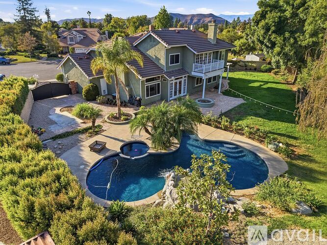 A house with a pool in the backyard.