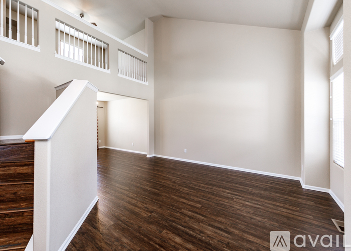 A room with wooden floors and white walls.