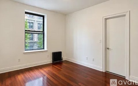 A room with a window and a door.