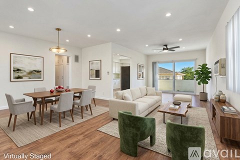 A modern living room with a dining table and chairs.