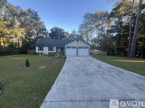 A house with a driveway in front of it.