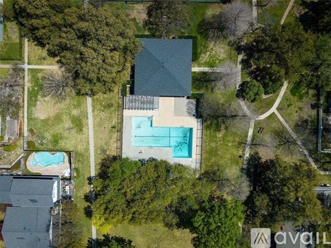 A house with a pool in the backyard.