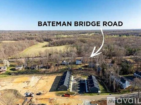A bird's eye view of a residential area with a road named Bateman Bridge Road.