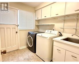 A laundry room with a washer and dryer.