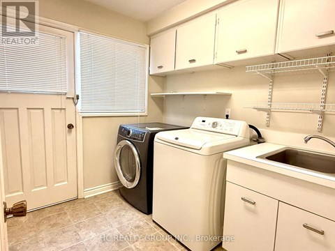 A laundry room with a washer and dryer.