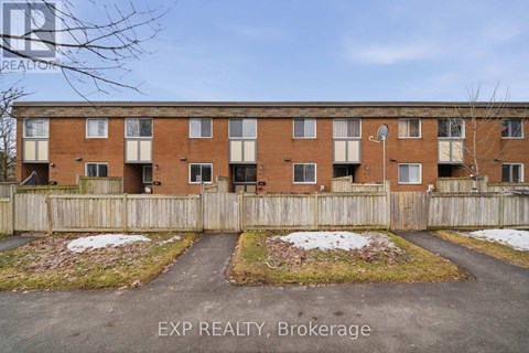 A building with the text EXP REALTY, Brokerage in the foreground.