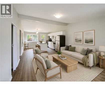 A well-lit living room with a couch, chairs, and a coffee table.