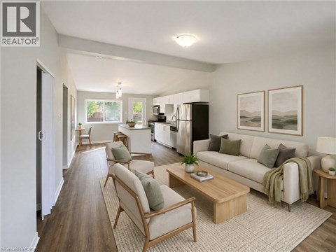 A well-lit living room with a couch, chairs, and a coffee table.