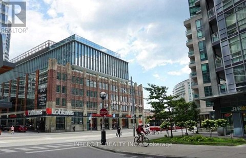 A city street with a cyclist and a pedestrian.