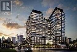 A modern multi-story building with a glass facade is depicted in the image.