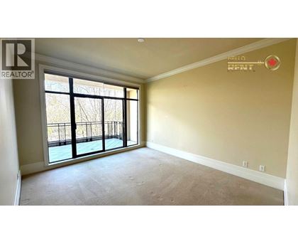 A room with a large window and a balcony is available for rent.