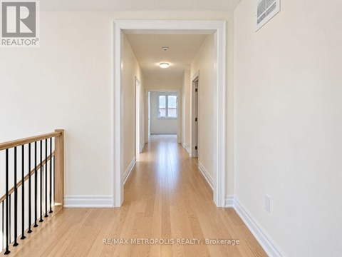 A long hallway with a light at the end.