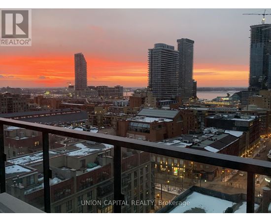 A cityscape at sunset with the Union Capital Realty logo in the foreground.