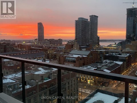 A cityscape at sunset with the Union Capital Realty logo in the foreground.