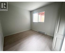 A room with a window and a door.