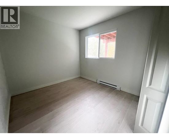 A room with a window and a door.