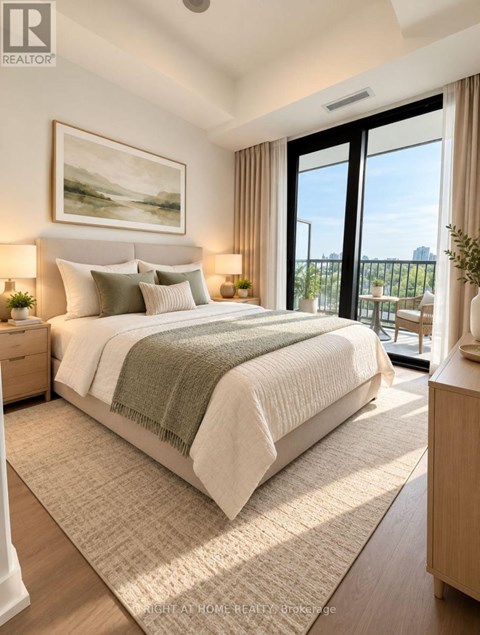 A bedroom with a large bed and a view of the city.
