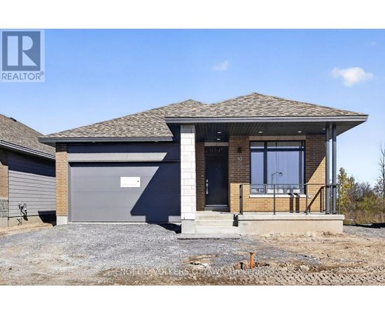 A house with a grey garage door is for sale.