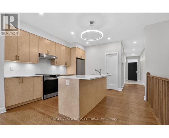 A kitchen with wooden cabinets and a white countertop.