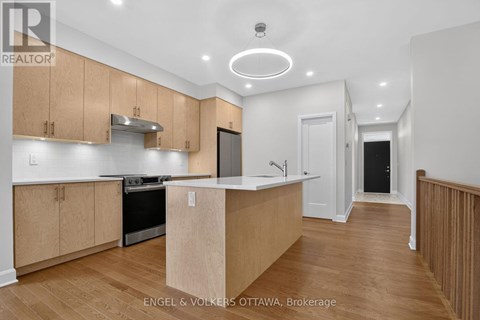 A kitchen with wooden cabinets and a white countertop.