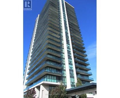 A tall residential building with balconies on each floor.