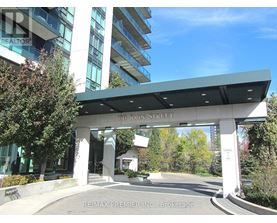 The entrance to a building with a sign that reads "100 John Street".