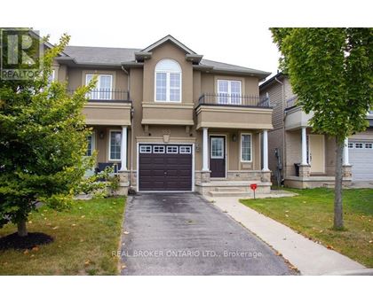 A large house with a driveway in front of it.