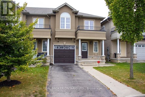 A large house with a driveway in front of it.