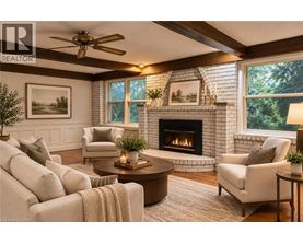 A living room with a fireplace and a ceiling fan.