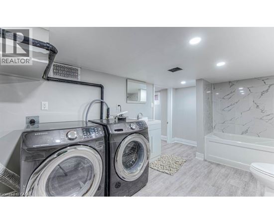 A laundry room with a washer and dryer.
