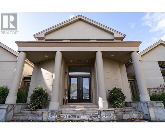 A house with a sign that says Century 21 Millennium Inc. Brokerage.
