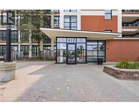 The entrance to a building with a sign that reads "410" is shown.