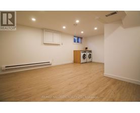 A room with a washer and dryer in it.