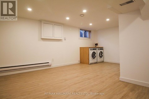 A room with a washer and dryer in it.
