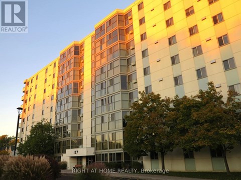 A building with the number 127 on it is shown in the image.