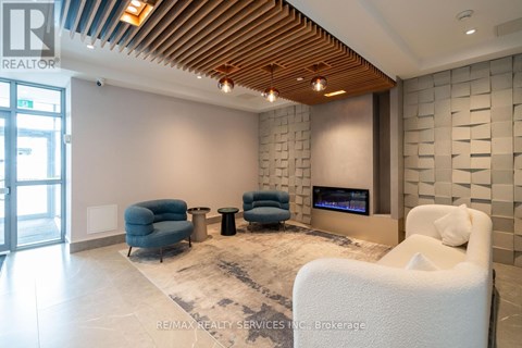 A modern living room with a wooden ceiling and a stone wall.
