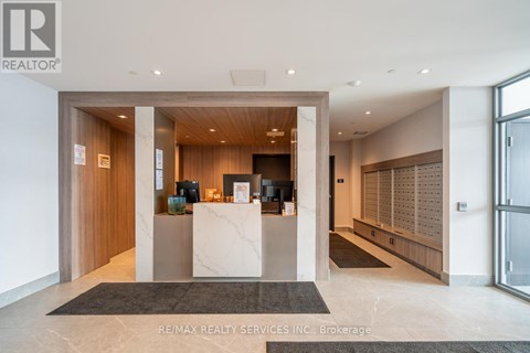A reception area with a desk and a large window.