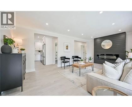 A modern living room with a black and white color scheme.