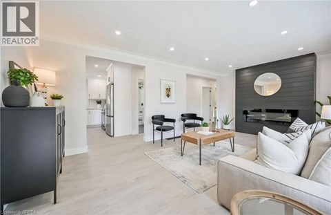 A modern living room with a black and white color scheme.