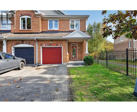 A house with a red garage door is for sale.