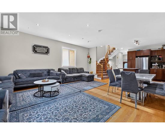 A living room with a grey couch and a coffee table.