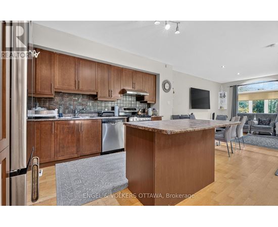 A modern kitchen with wooden cabinets and a central island.