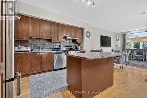 A modern kitchen with wooden cabinets and a central island.