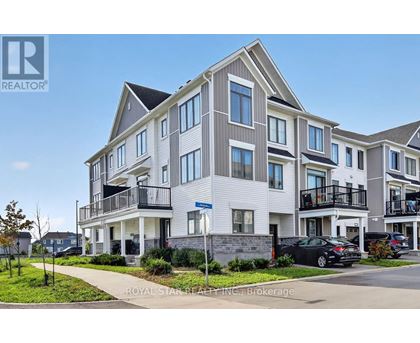 A modern apartment building with a car parked in front.