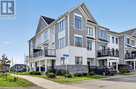 A modern apartment building with a car parked in front.