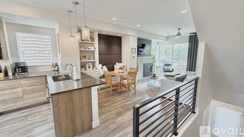 A modern kitchen with wooden cabinets and a large island.